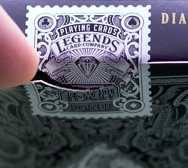 Detail showing a perforated stamp-seals which mimic the old tax seals from Legends Playing Card Company.
