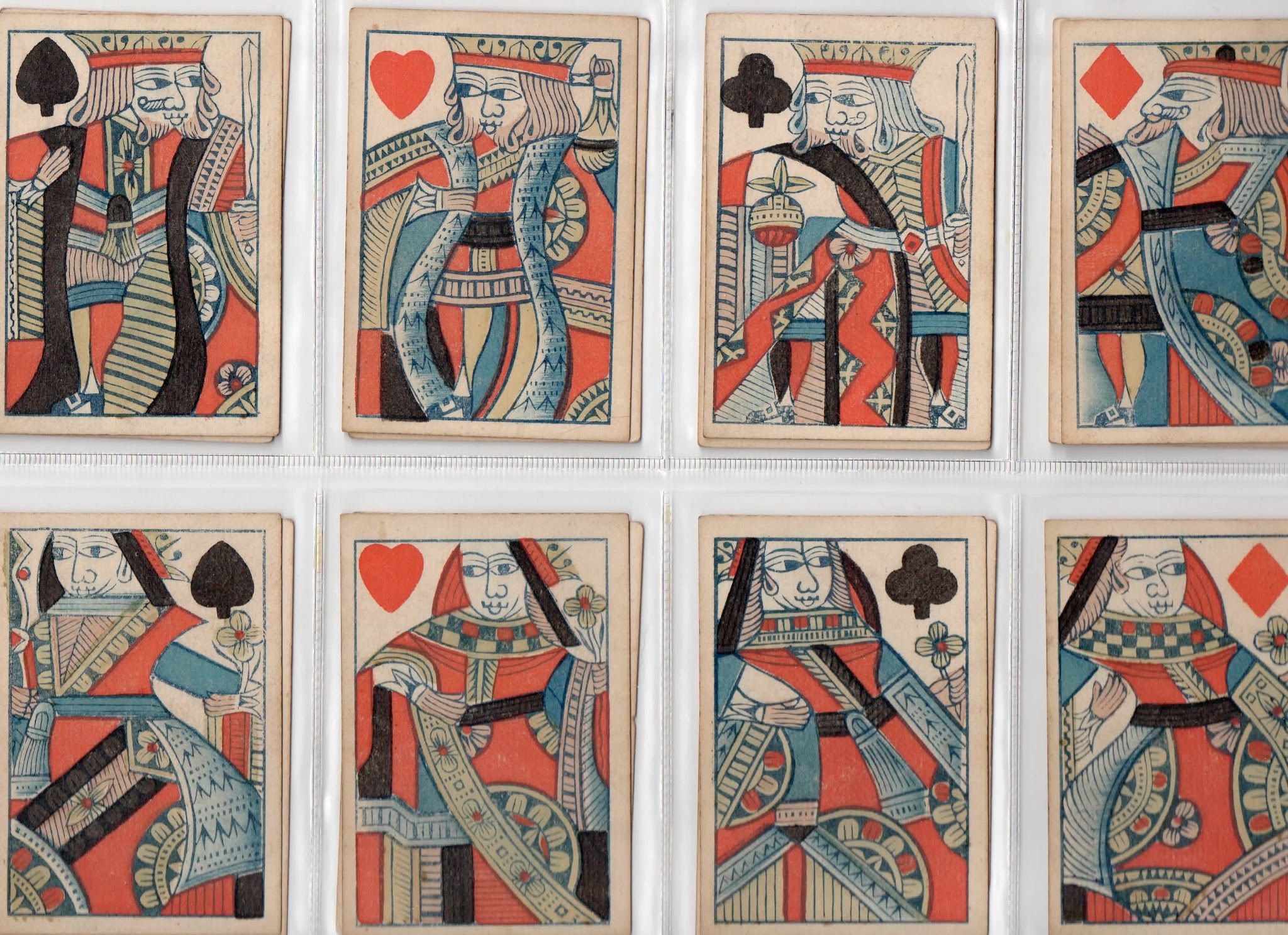 King, Queen and Jack playing cards (coloured wood engraving)