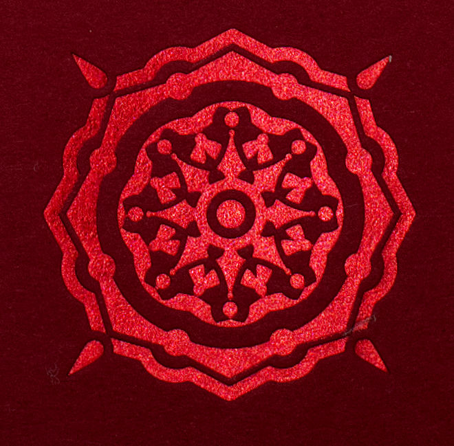 Red letterpress motif used on the Summer Solstice tuck case