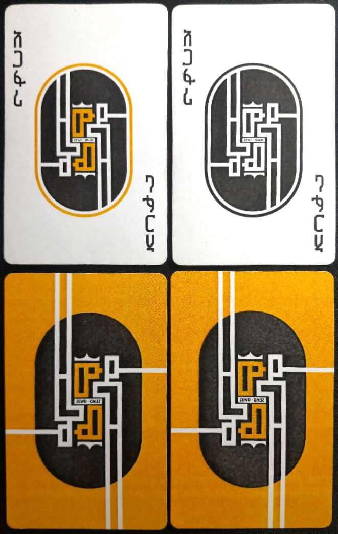 Two Zewd joker cards above two card backs in yellow and white colourways.