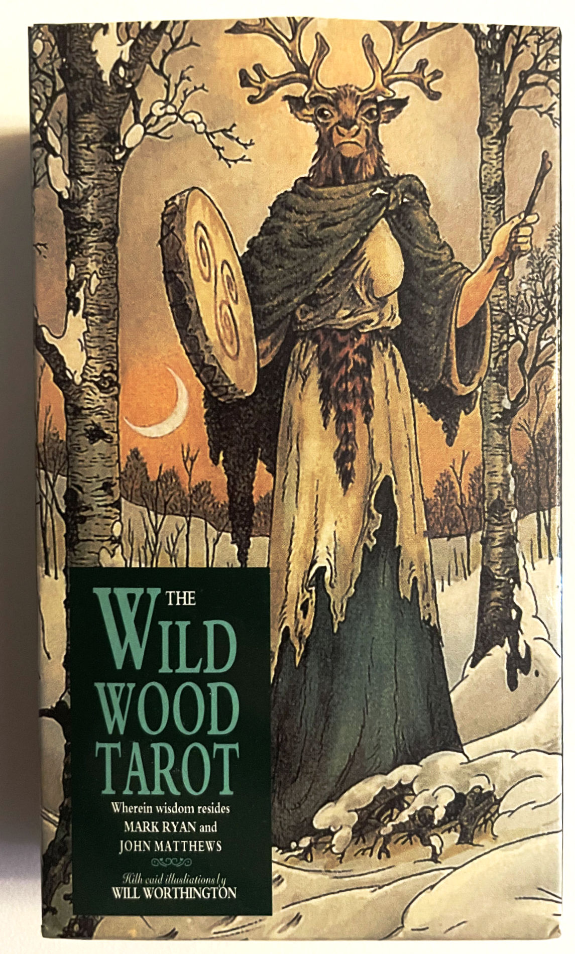 The Wildwood Tarot box front showing the antlered Woodward among birch trees