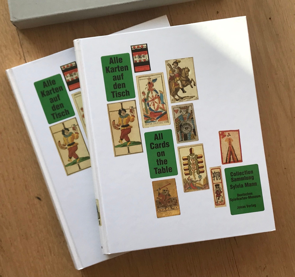Two volumes of “All Cards on the Table” by Sylvia Mann, shown together.