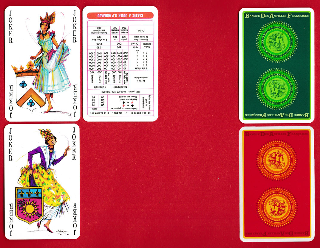 Two illustrated jokers, a score card, and green and red card backs from the Banque des Antilles Françaises pack