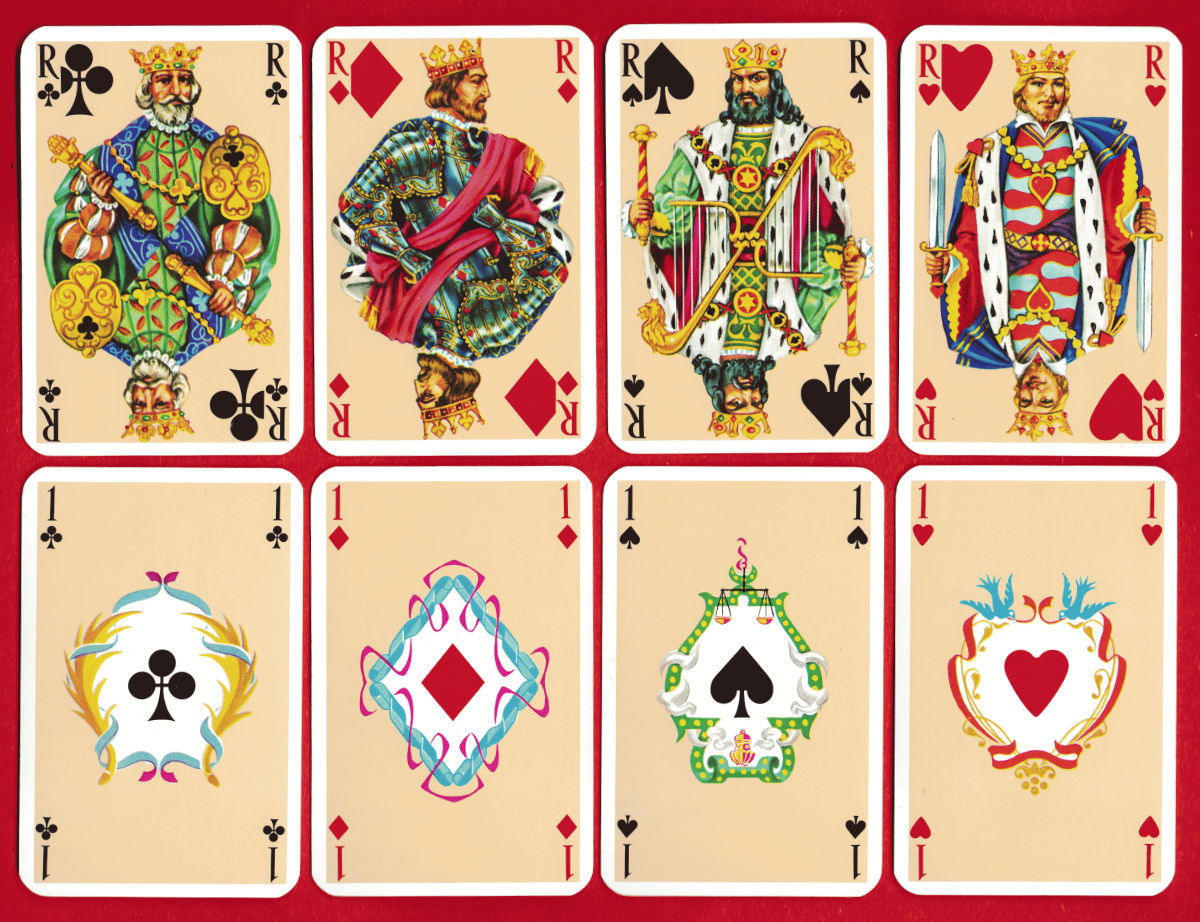 Kings and aces from the Chambord pack, with heraldic frames around the suit symbols