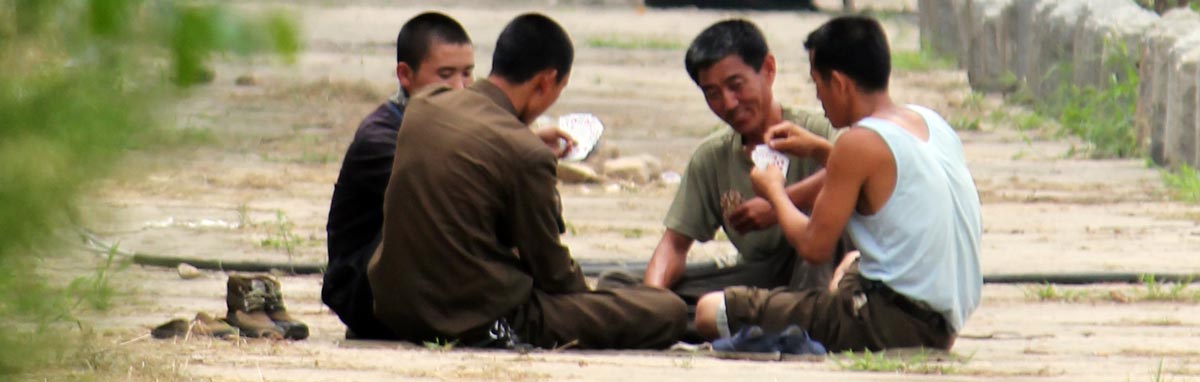 Korean workmen playing cards during lunch break