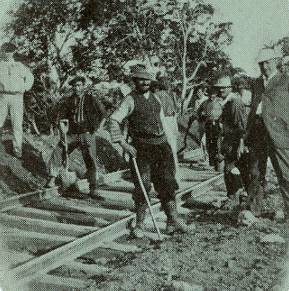 detail from Panama Canal souvenir card showing Spanish and Italian workmen laying railroad track, 1908 detail from Panama Canal souvenir card showing Spanish and Italian workmen, 1908